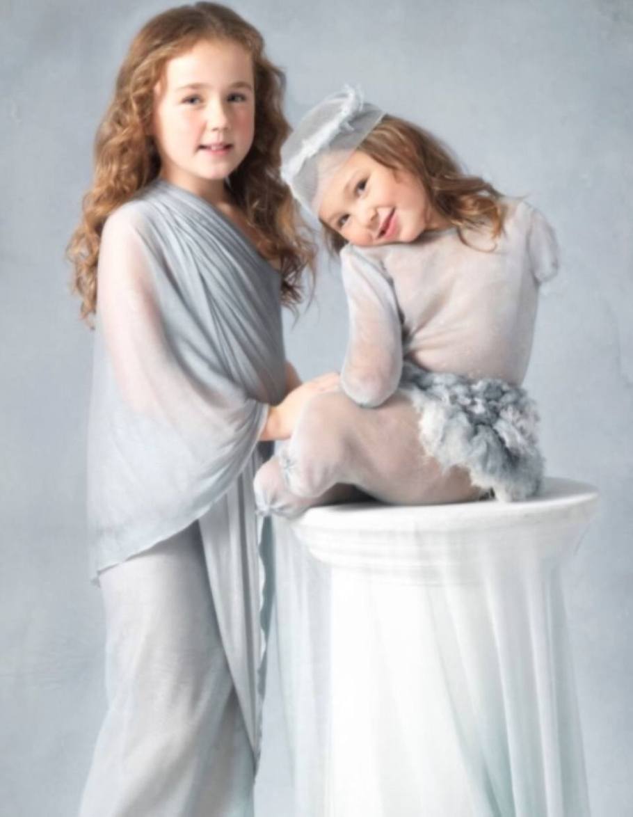 Amber, five, from Croxteth, Liverpool, is the youngest child to be photographed by Anne Geddes. Amber lost her legs and arms after contracting the disease aged two. She is pictured with her sister Jade.