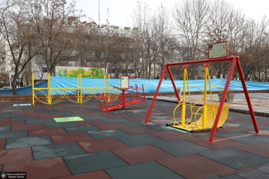 Image depicts three colorful items of accessible playground equipment.