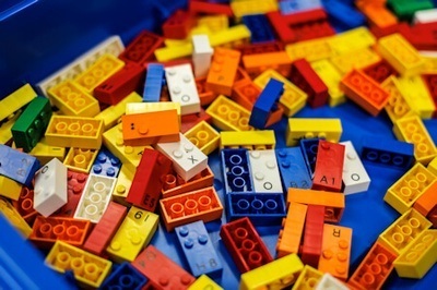 Assortment of different colored Lego Braille Bricks.