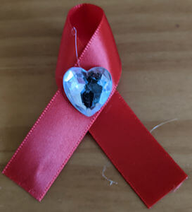 Samantha S. sent us her recommendation for a COVID-19 ribbon. The red signifies the fight against the coronavirus, and the heart represents the essential workers.