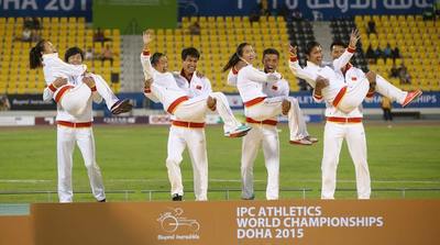 China celebrate winning gold medals in the women's 4x100m T11-13 final