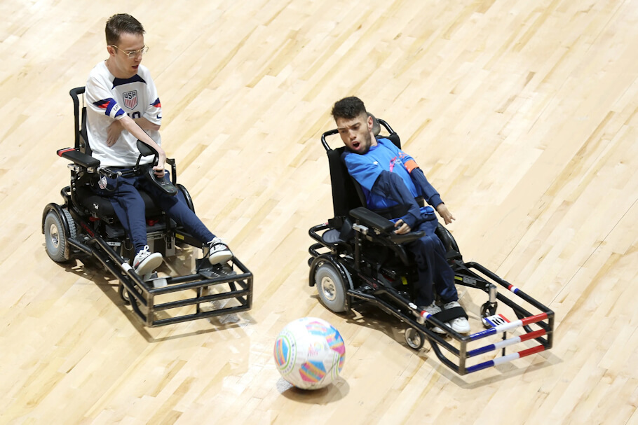 Riley Johnson of the United States of America and Mohamed Ghelami of France compete for the ball during the day 2 match between France and the USA in the 2023 FIPFA Powerchair World Cup.