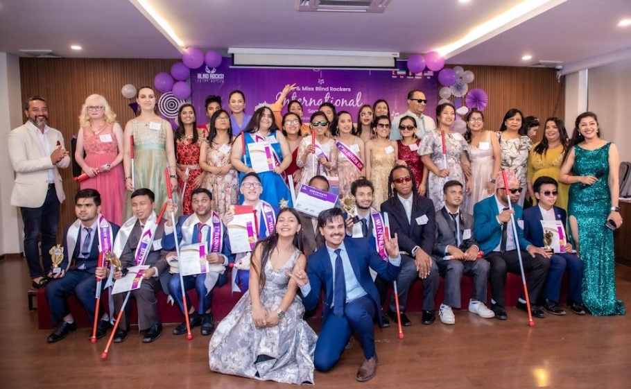 Group photo of Mr. and Miss Blind Rockers beauty pageant contestants and others.