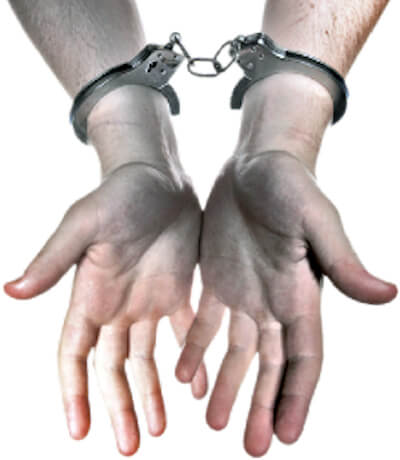 Image of a persons hands and forearms wearing handcuffs.