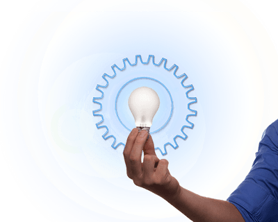 Image shows a persons arm holding a light bulb in their hand with a background illustration of a blue mechanical gear and illumination effects.