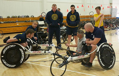 Naval Base Ventura County, Calif. Navy Wounded Warriors learn how to cycle safely during their track training session at the adaptive athletics camp on Naval Base Ventura County. U.S. Navy photo by Shannon Leonard.