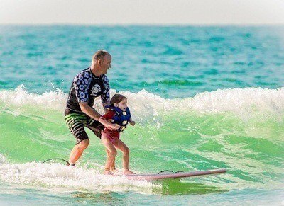 Learning to surf at summer camp