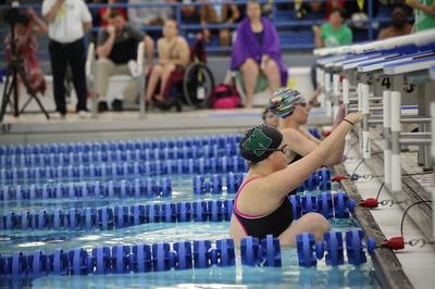 Swimmers poised for start of a swimming race, one of the Turnstone Endeavor Games events.