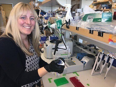 At a UW Medicine research lab, Tychele Turner studies gene mutations suspected in autism. These mutations appear in affected children, but not in their parents, and are found in both coding and non-coding regions of the genome - (Michael McCarthy/UW Medicine).