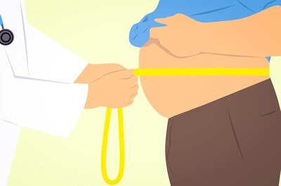 Diagram of a man with excess belly fat having his waistline measured by a doctor.